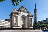 France, Nord, Lille, Porte de Paris with the belfry of town hall listed as World Heritage by UNESCO