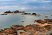 United Kingdom, Channel Islands, Jersey, La Corbière lighthouse at rising tide