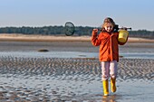 France, Somme, Baie de Somme, Le Crotoy, Child (girl) in shrimp fishing