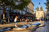 France, Gironde, Bordeaux, area listed as World Heritage by UNESCO, Saint-Pierre district, Place du Palais, in the background the Porte Cailhau or Porte du Palais from the 15th century