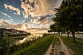 France, Somme, Baie de Somme, Saint-Valery-sur-Somme, Twilight over the village from the Somme channel at low tide