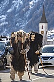 Switzerland, Valais, Lotschental valley, Wiler, Tschaggatta Carnival, costumes are made from animal skins, wooden masks and horse hair