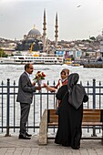 Turkey, Istanbul, Karakoy area, proposing in front of the mother