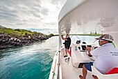 Ecuador, Galapagos archipelago, listed as World Heritage by UNESCO, Gone from the island of San Cristóbal, a group of naturalist observers heads for Lobos island