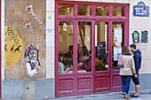 France, Paris, street art, writting and mural by street artist Miss.Tic on the facade of Chez Gladines restaurant in rue des Cinq Diamants in Butte aux Cailles district