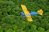 Canada, Province of Quebec, Mauricie Region, Seaplane Adventure, Flight of a Boeing Stearman 1943 over Canopy of the Boreal Forest