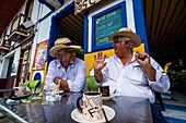 Colombia, Valley of coffee, Marseilla, sharing a coffee on terrace with Don Luis, rich local cafetero