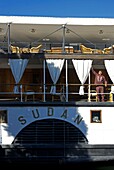 Egypt, Upper Egypt, Nile Valley, staff member of the Steam Ship Sudan, the last steamboat crossing the Nile, in a gangway of the ship