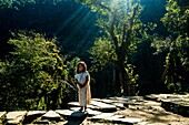 Colombia, Sierra Nevada de Santa Marta, Tayrona Park, trek of the Lost City, registered World Heritage by UNESCO, kogi child contemplating the ruins