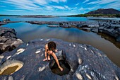 Colombia, Vichada, Puerto Carreno, Ventana Reserve on the Orenoco river, walk on the submerged rocks and swim in water holes