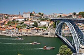 Portugal, North Region, Porto, historical center classified as World Heritage by UNESCO, historical district Cais de Ribeira, the Dom-Luis I bridge dominated by the cathedral and episcopal palace and built between 1881 and 1886 by engineer Theophile Seyrig disciple of Gustave Eiffel and who spans the river Douro