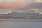 Philippines, Palawan, Malampaya Sound Protected Landscape and Seascape, fisherman sailling on his boat