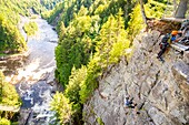 Canada, Quebec province, Beaupre, Sainte Anne Canyon dug by the Saint Anne du Nord River, and with a 74m high waterfall, climbing