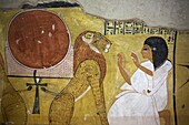 Egypt, Upper Egypt, Nile Valley, Valley of Craftsmen, polychrome painting depicting an ancient Egyptian and a lion adorning the tomb of the chief craftsmen Sen Negem at Deir el Medina, the valley of craftsmen