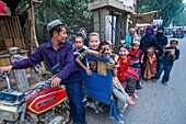 China, Xinjiang autonomous region, Hotan, school pick-up