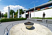 Switzerland, Canton of Vaud, Lausanne, Ouchy district, Olympic museum in Lausanne, the Olympic flame and Pierre de Coubertin statue by Jean Cardot