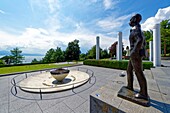 Switzerland, Canton of Vaud, Lausanne, Ouchy district, Olympic museum in Lausanne, the Olympic flame and Pierre de Coubertin statue by Jean Cardot