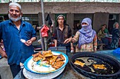 China, Xinjiang autonomous region, Hotan, bazaar, market, fast food stalls, from local specialties like sheep fritters