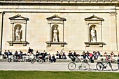 Germany, Bavaria, Munich, Königsplatz, Glyptothek, museum founded in 1830 by the King Louis 1st of Bavaria to welcome its collections of Greek and Roman sculptures, student working leaning against the neoclassical facade