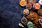 Selection of dried and canned legumes, and pasta made from legumes for plant-based whole food diet.