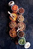 Selection of dried and canned legumes, and pasta made from legumes for plant-based whole food diet.