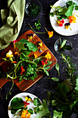 Cooking with herbs and edible flowers concept.