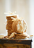 Fresh, crispy baked almond biscuits in a biscuit tin