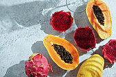 Dragon fruit,also known as pitaya,sliced pink-magenta coloured flesh with tiny black seeds,tropical fruit,long with pspsys fruit
