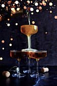 Champagne Celebration on Dark Background with Bokeh Lights.