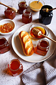 Selection of Australian honey, including Yellowbox, Ironbark, Macadamia, Rainforest, Tea Tree, Manuka, Creamed Honey and Honeycomb.