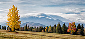 USA, New York, Adirondacks. Lake Placid, panoramic view of clouds pouring over Mt. Marcy in autumn