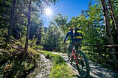 Cyclist, Ru Neuf torrent, Etroubles, Valle d'Aosta, Italy, Europe