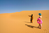 Girl looking for the sea in the Sahara desert, Erg Awbari, Sahara desert, Fezzan, Libya, North Africa, Africa