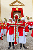 Penitents holding cross made with flowers, Enna, Sicily, Italy, Mediterranean, Europe