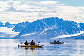 Guests from the Lindblad Expedition ship National Geographic Explorer kayaking in the Svalbard Archipelago, Norway, Arcitc, Europe