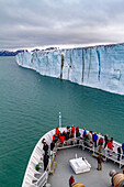 The Lindblad Expedition ship National Geographic Explorer near a glacier in the Svalbard Archipelago, Norway, Arctic, Europe