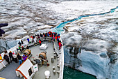 The Lindblad Expedition ship National Geographic Explorer near glacial run-off in the Svalbard Archipelago, Norway, Arctic, Europe