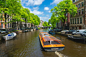 Touristenboot auf dem Herengracht-Kanal,Amsterdam,Niederlande,Europa