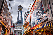 Evening lights in the Shinsekai area, and view of Tsutenkaku Tower and restaurants neon lights, Osaka, Honshu, Japan, Asia