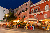 View of restaurant on Via Luigi Mazzella at night, Port of Ischia, Island of Ischia, Campania, Italy, Europe