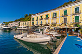 View of boats and restaurants in Porto d'Ischia (Port of Ischia), Island of Ischia, Campania, Italy, Europe