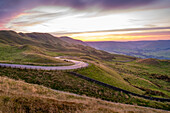 View of landscape and trail lights in the Hope Valley at sunset, Peak District National Park, Baslow, Derbyshire, England, United Kingdom, Europe