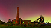 View of Northern Lights (Aurora borealis) and Pleasley Colliery Headstocks, Bolsover, Derbyshire, England, United Kingdom, Europe