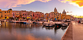 View of Church of Santa Maria della Pieta in the fishing port Marina Grande with boats at golden hour, Procida, Phlegraean Islands, Gulf of Naples, Campania, Southern Italy, Italy, Europe