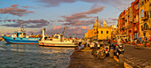 View of Church of Santa Maria della Pieta in the fishing port Marina Grande with shops at golden hour, Procida, Phlegraean Islands, Gulf of Naples, Campania, Southern Italy, Italy, Europe