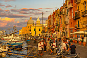 View of Church of Santa Maria della Pieta in the fishing port Marina Grande with boats at golden hour, Procida, Phlegraean Islands, Gulf of Naples, Campania, Southern Italy, Italy, Europe