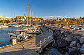 View of Church of Santa Maria della Pieta in the fishing port Marina Grande with boats at golden hour, Procida, Phlegraean Islands, Gulf of Naples, Campania, Southern Italy, Italy, Europe