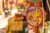 View of colourful souvenir tambourine in narrow backstreet in the fishing port, Procida, Phlegraean Islands, Gulf of Naples, Campania, Southern Italy, Italy, Europe