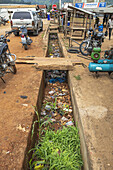 Trash in sewer in Amlame, Togo, West Africa, Africa