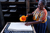 Worker making tofu, a food prepared by coagulating soy milk, in a traditional family factory, Yogyakarta, Java, Indonesia, Southeast Asia, Asia, Asia